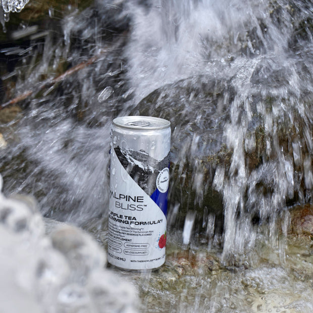 Alpine Bliss Purple Tea Weight loss drink  flavored sparkling water in a waterfall. Low calorie energy drink with caffeine.